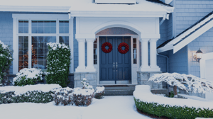 Blue home with snow