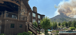 Luxury home with wildfire smoke in background